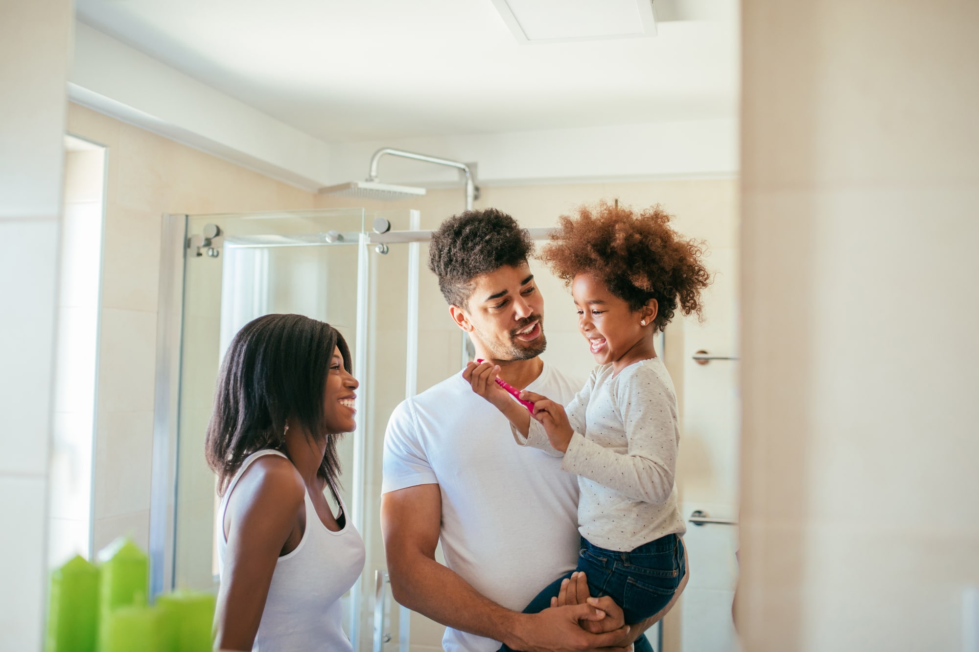 African American family in newly remodeled bathroom